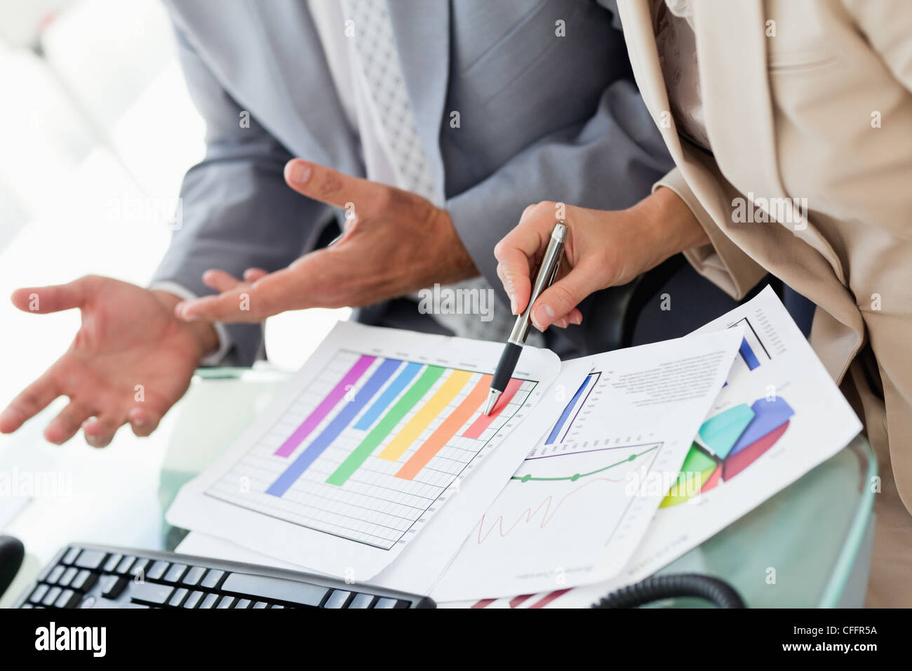 Business people working on statistics Stock Photo - Alamy