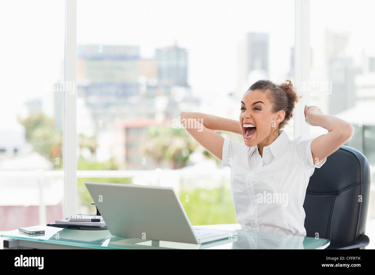 Tanned businesswoman extremely happy Stock Photo