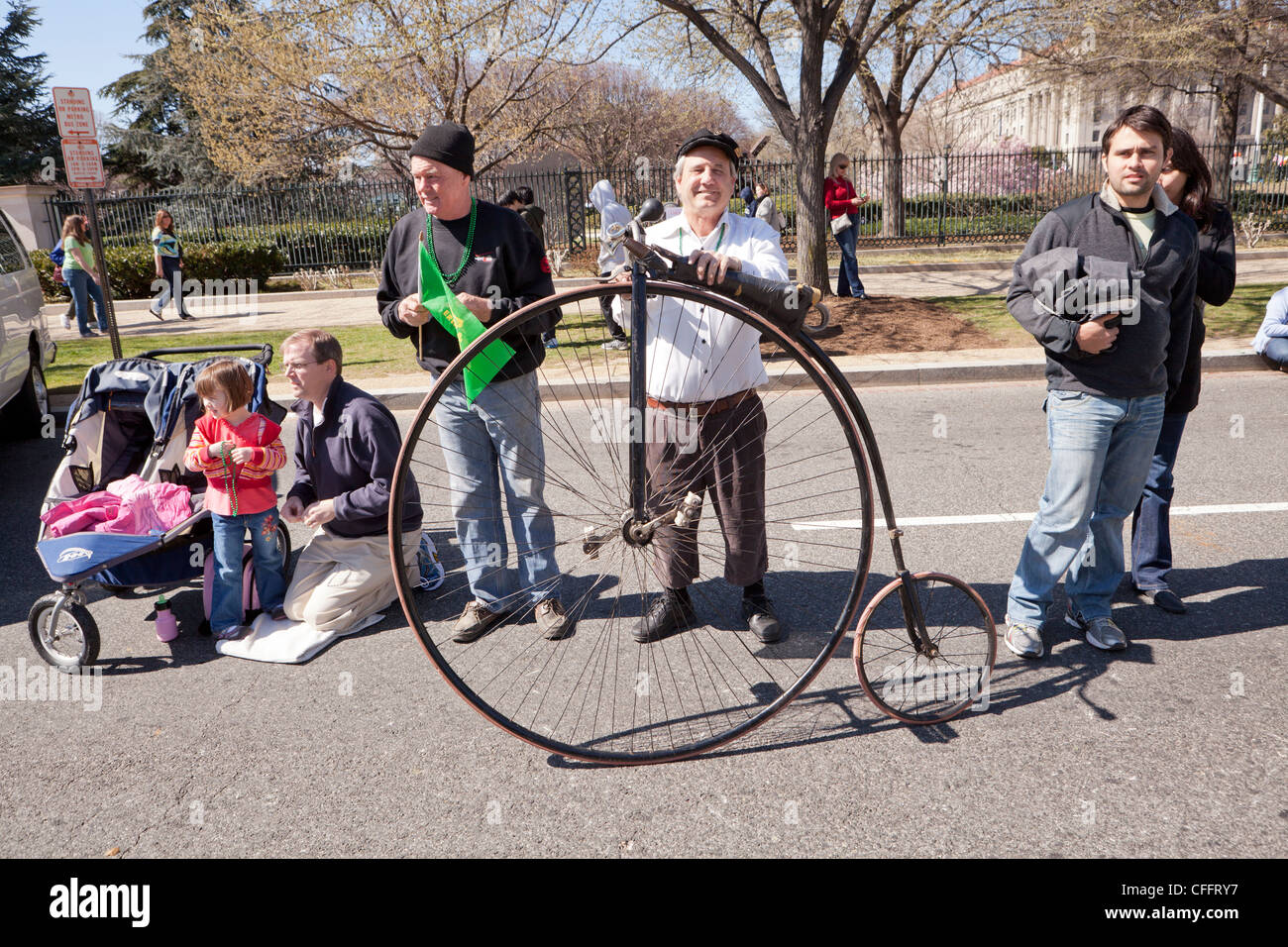 Man standing next to a high-wheel high wheel bicycle Stock Photo