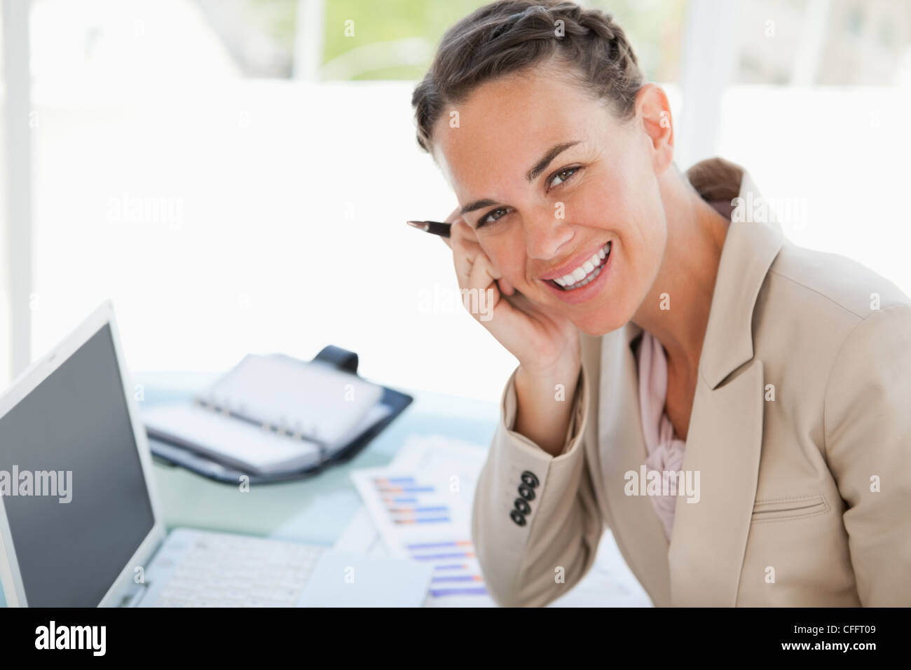 Portrait of a smiling businesswoman with a braid Stock Photo