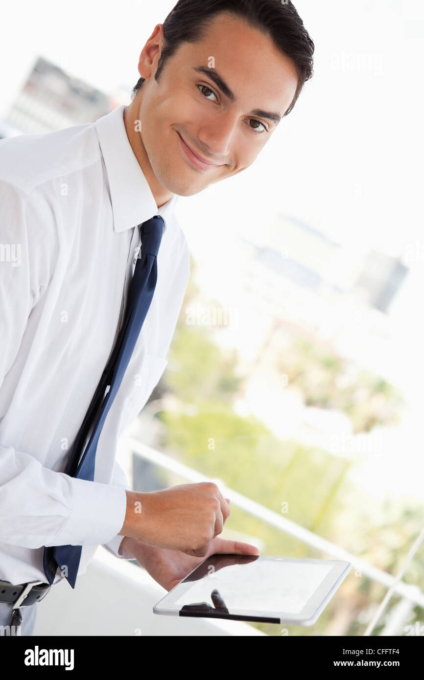 Portrait of a businessman using a touch pad Stock Photo - Alamy