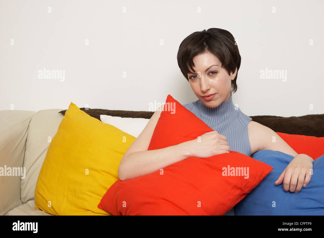 Woman Relaxing in Living Room Stock Photo - Alamy