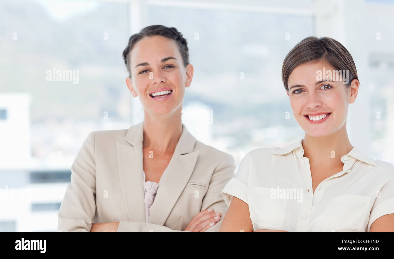 Smiling saleswomen standing Stock Photo