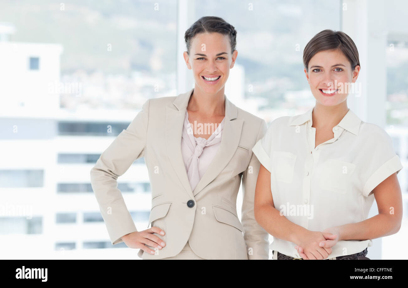 Smiling businesswomen standing Stock Photo