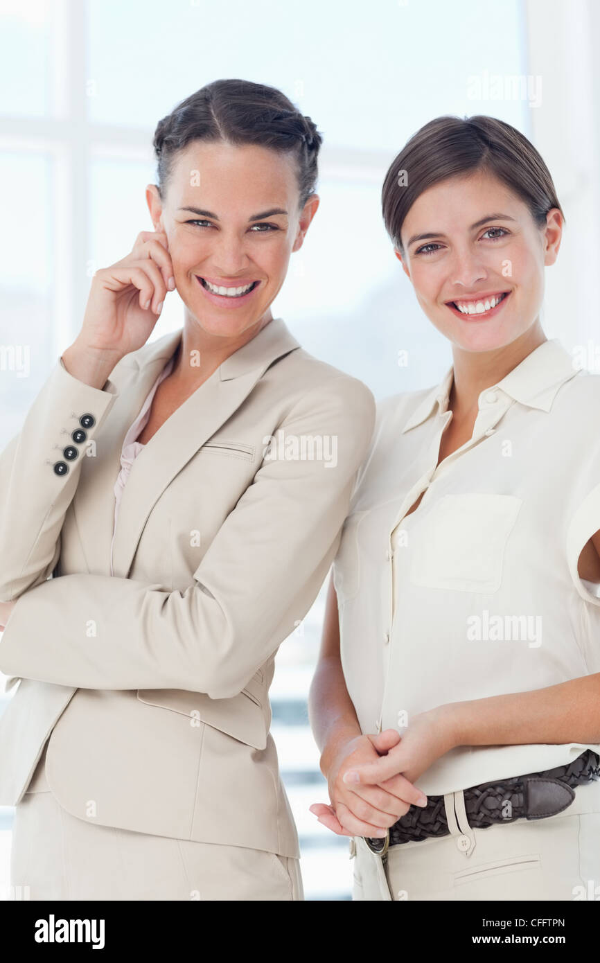 Smiling businesswomen standing together Stock Photo