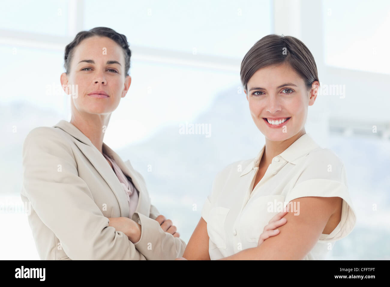 Confident businesswomen with arms crossed Stock Photo