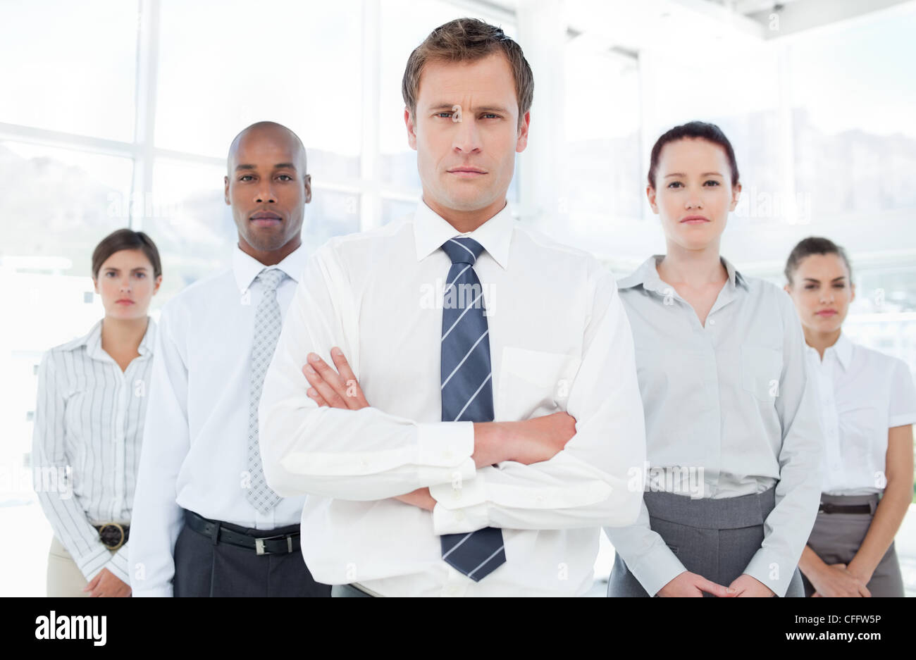 Confident businessman with his team Stock Photo