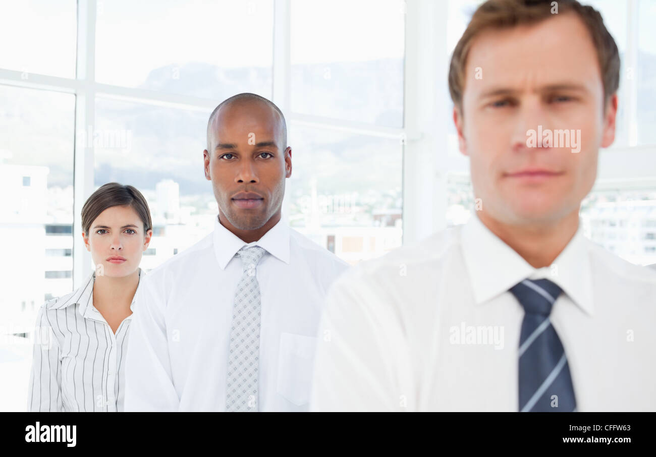 Salespeople standing in a row Stock Photo