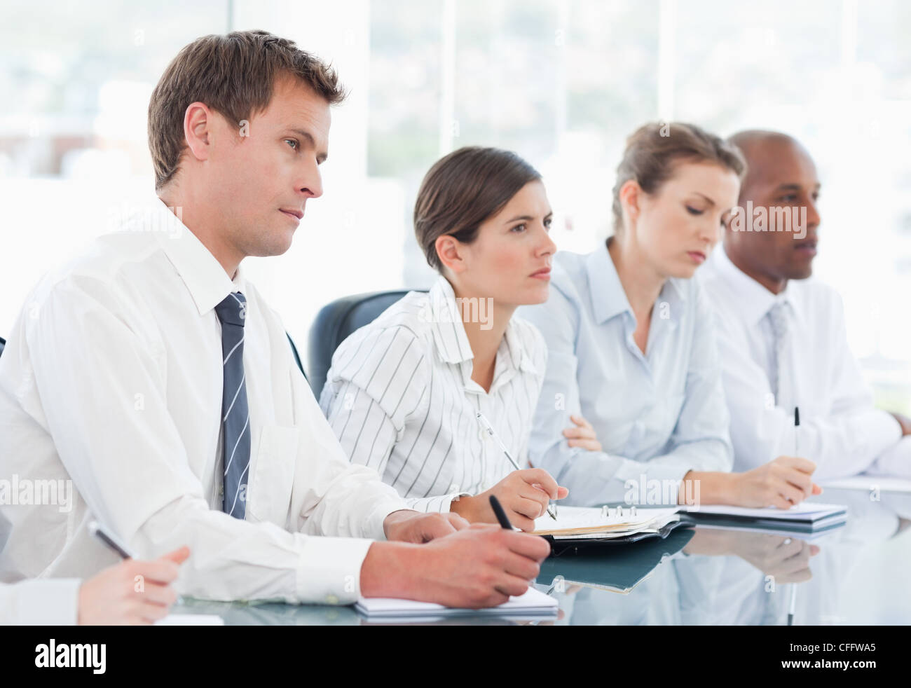 Businesspeople watching a presentation Stock Photo