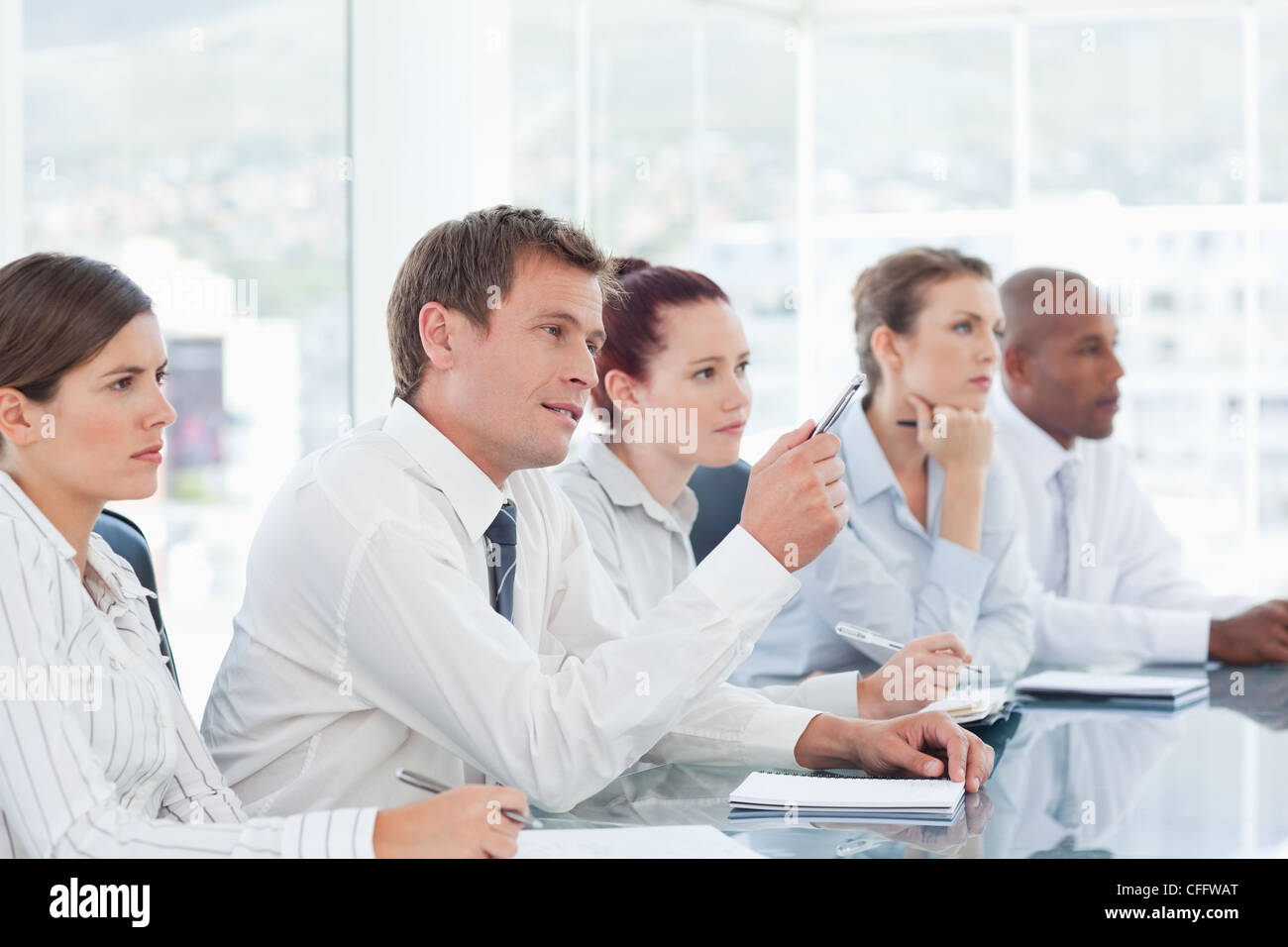 Salesteam sitting in a negotiation Stock Photo