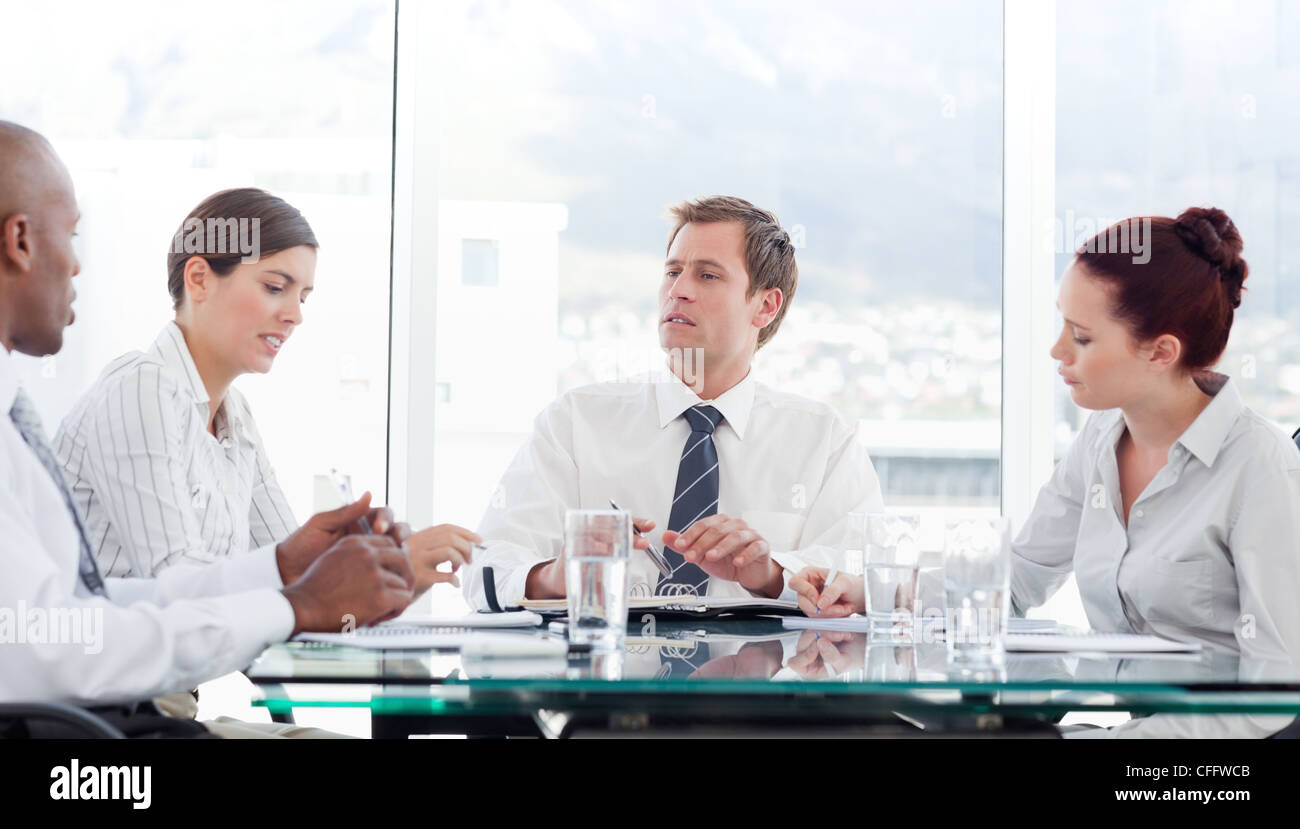 Salesman talking to his colleagues during a meeting Stock Photo