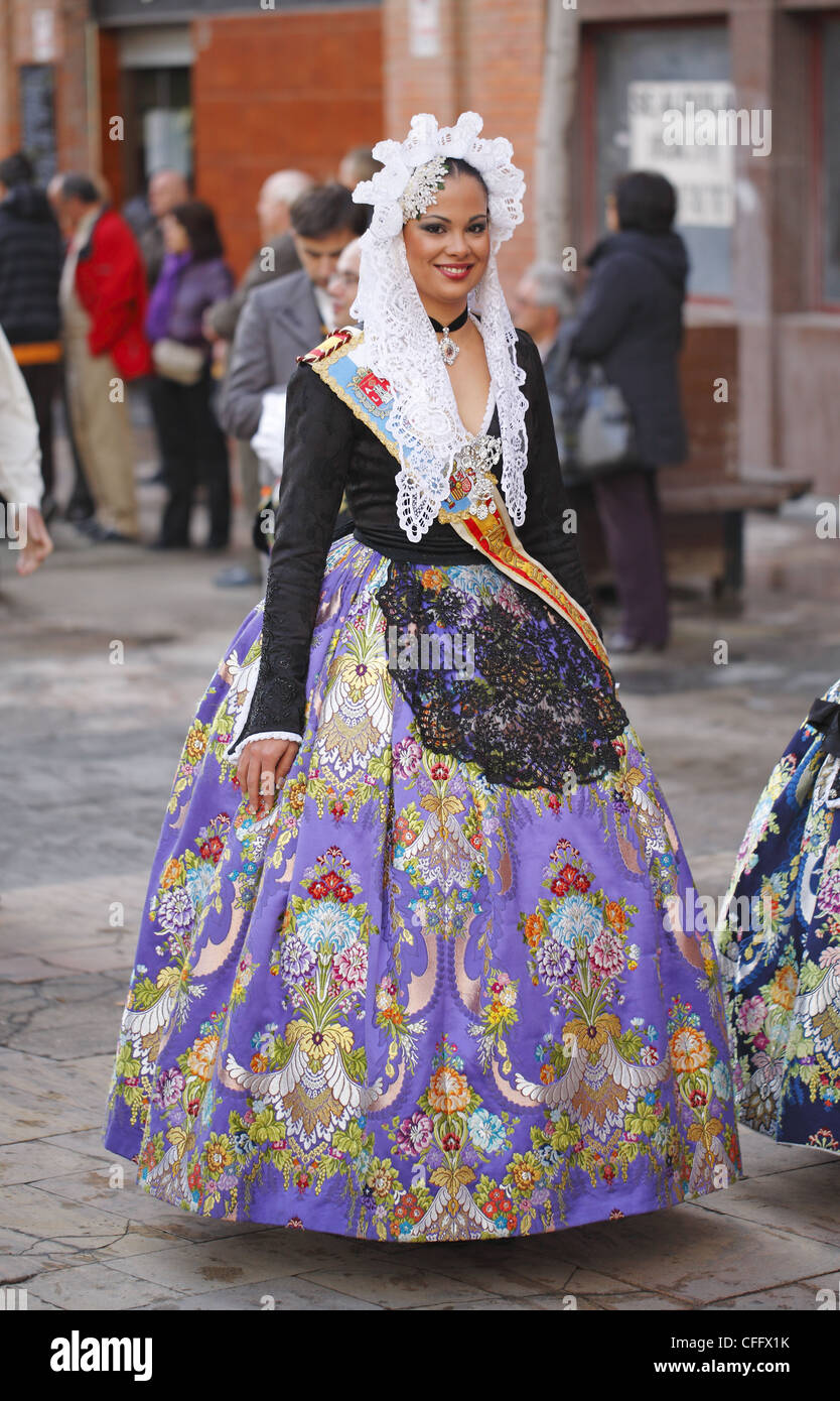 Spanish woman wearing traditional dress during the street procession ...