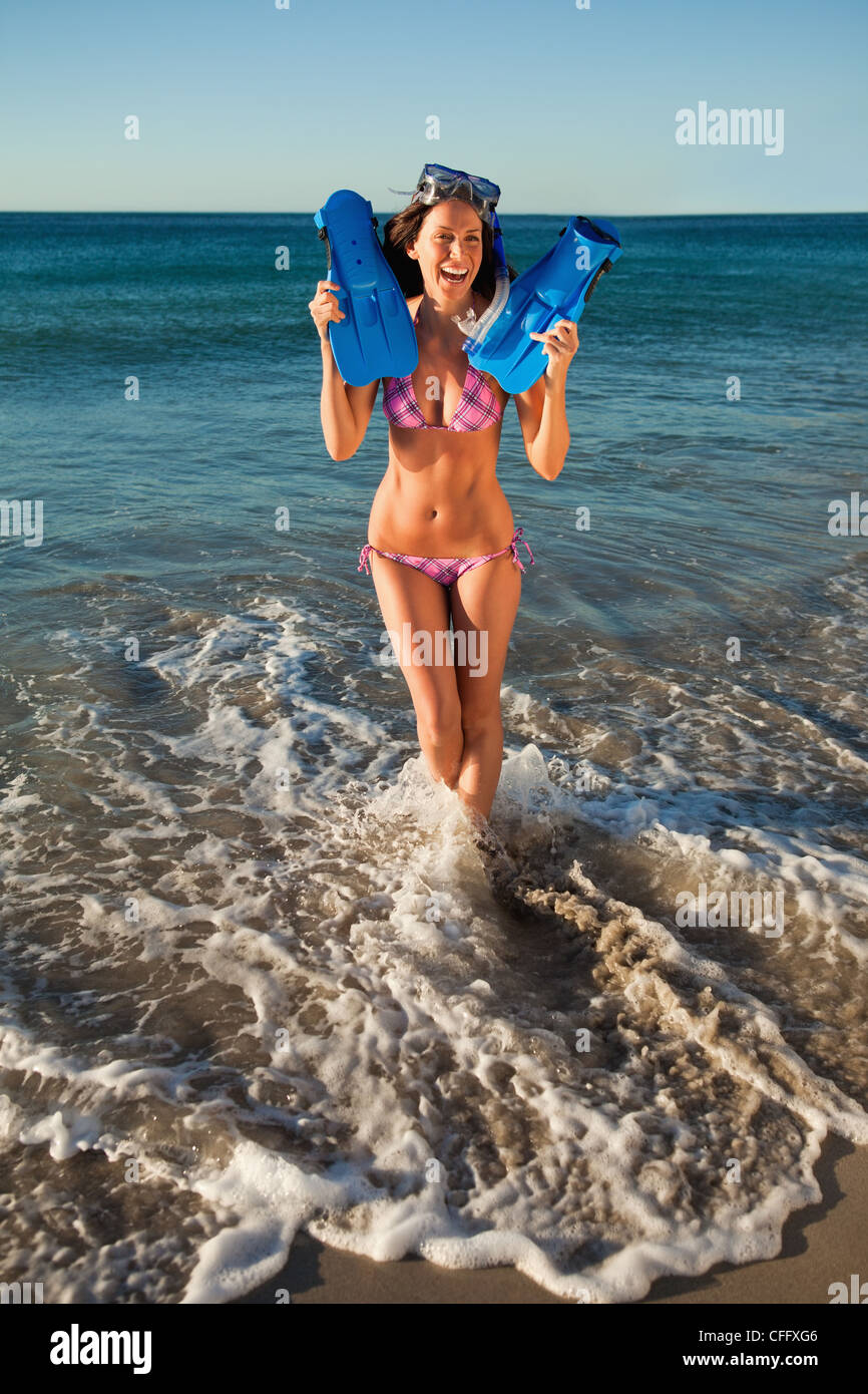 Laughing woman with snorkeling equipment Stock Photo