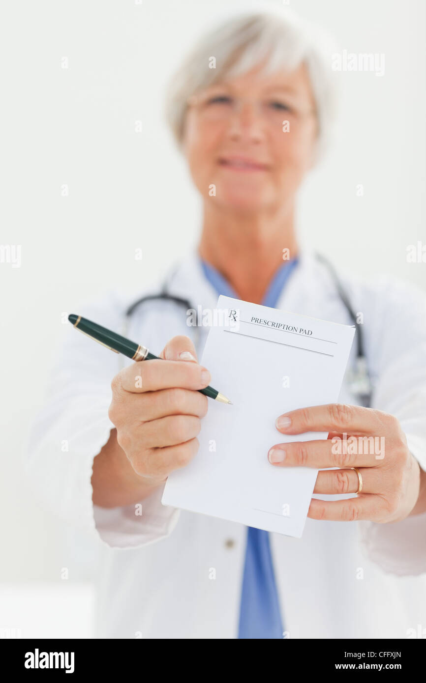 Prescription pad being shown by doctor Stock Photo Alamy