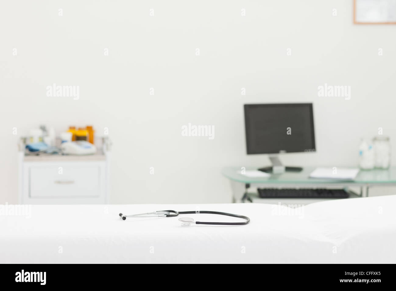 Stethoscope lying on mattress in an examination room Stock Photo