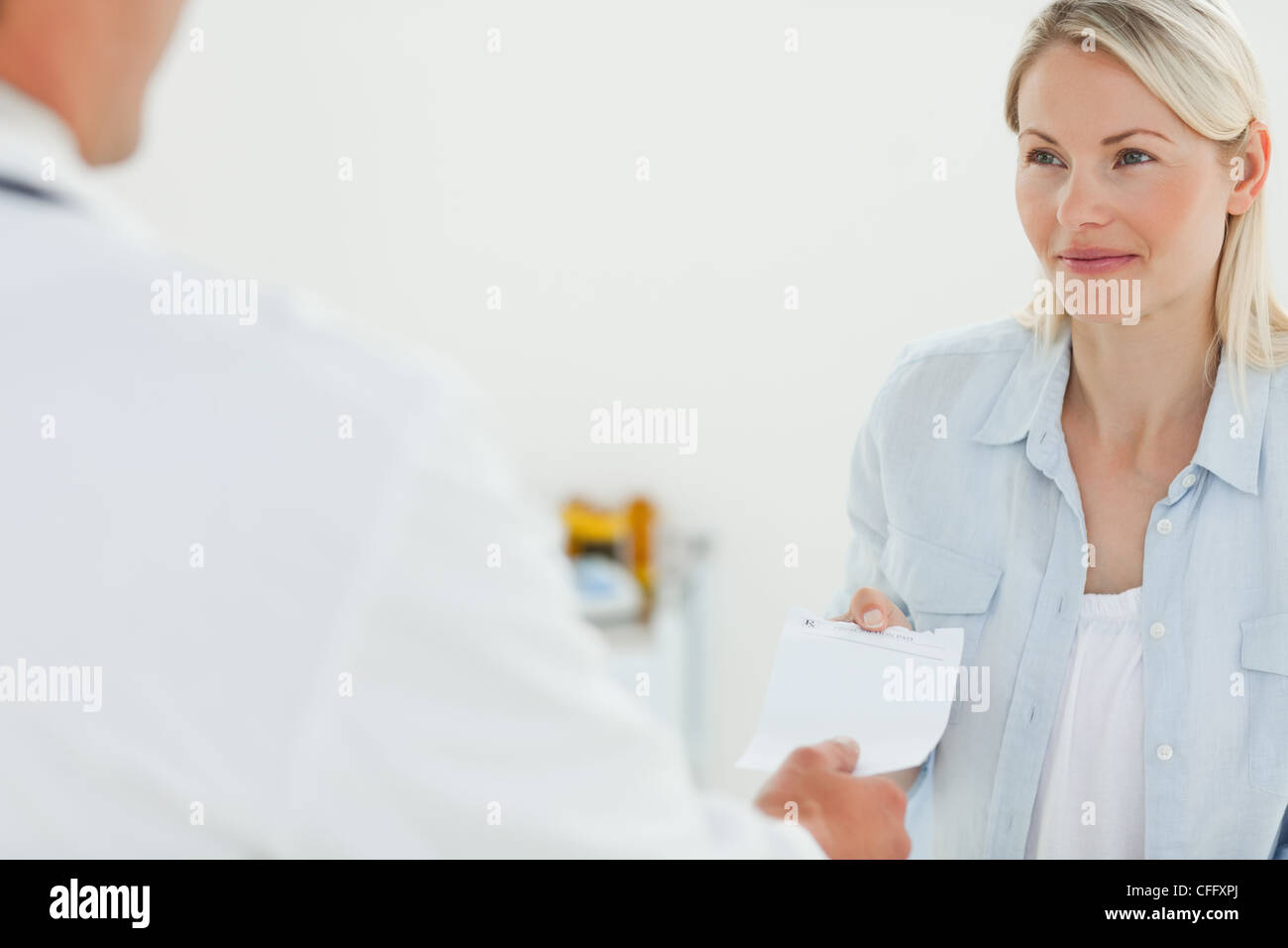 Patient receiving prescription from her doctor Stock Photo - Alamy