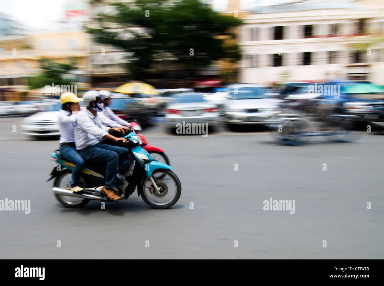 Rushing home on their motorcycle. Stock Photo