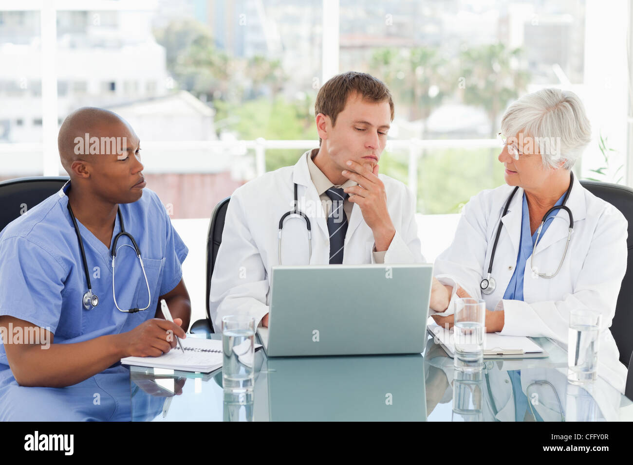 Doctors in a meeting room Stock Photo