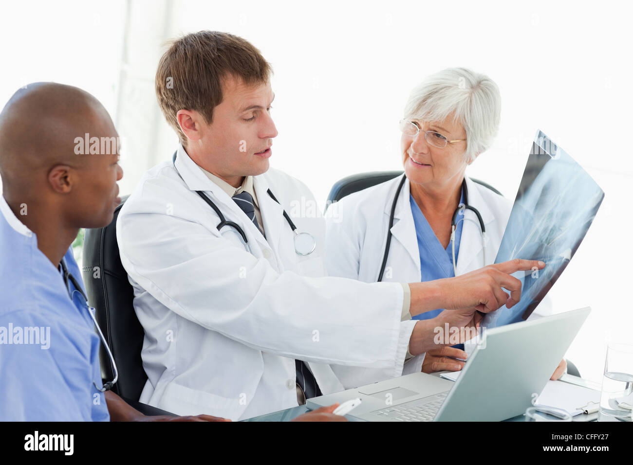 Medical team looking at an x-ray Stock Photo