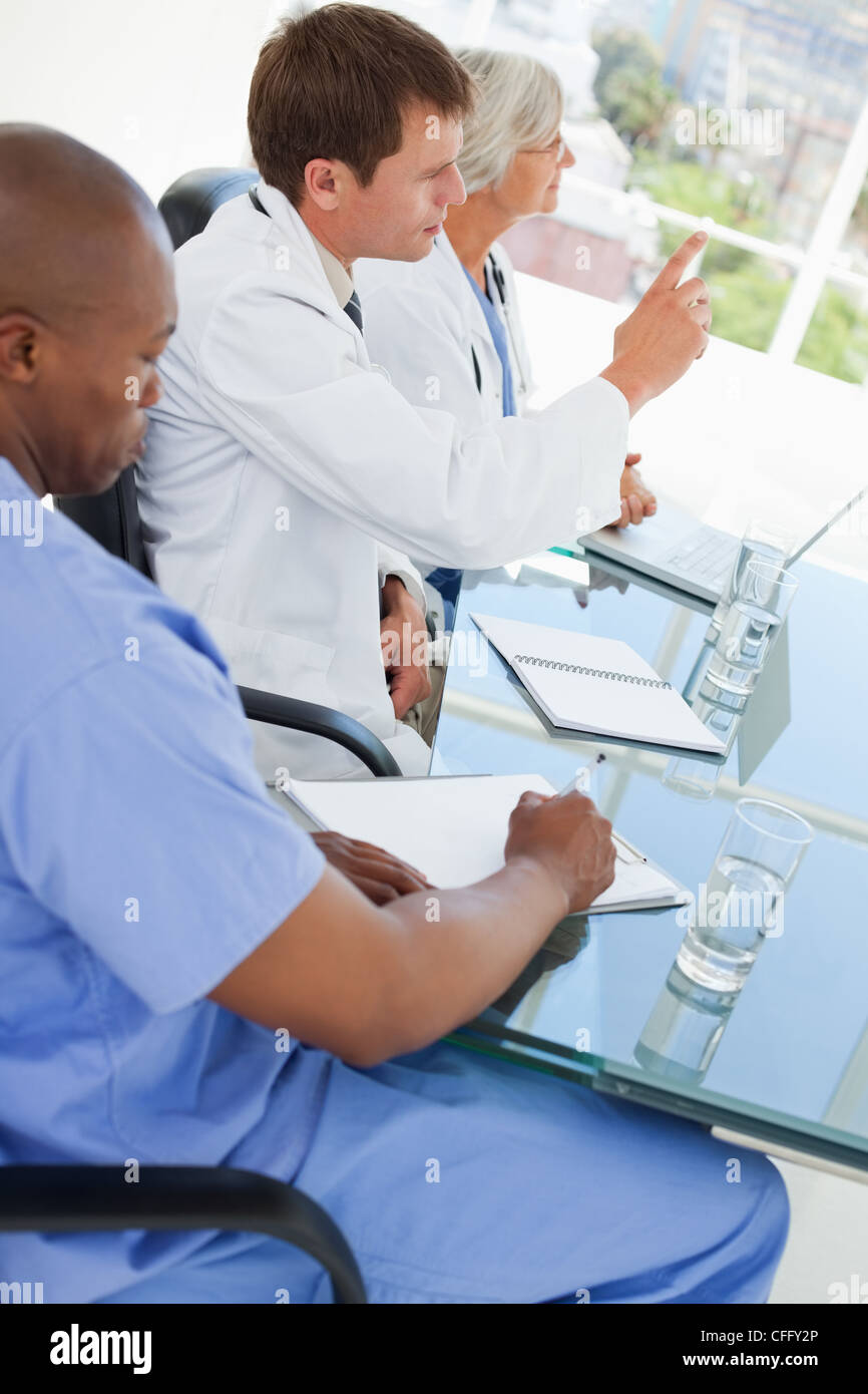 Side view of doctors watching a presentation Stock Photo