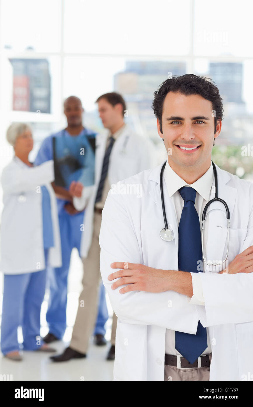 Young doctor folded arms smiling hi-res stock photography and images ...