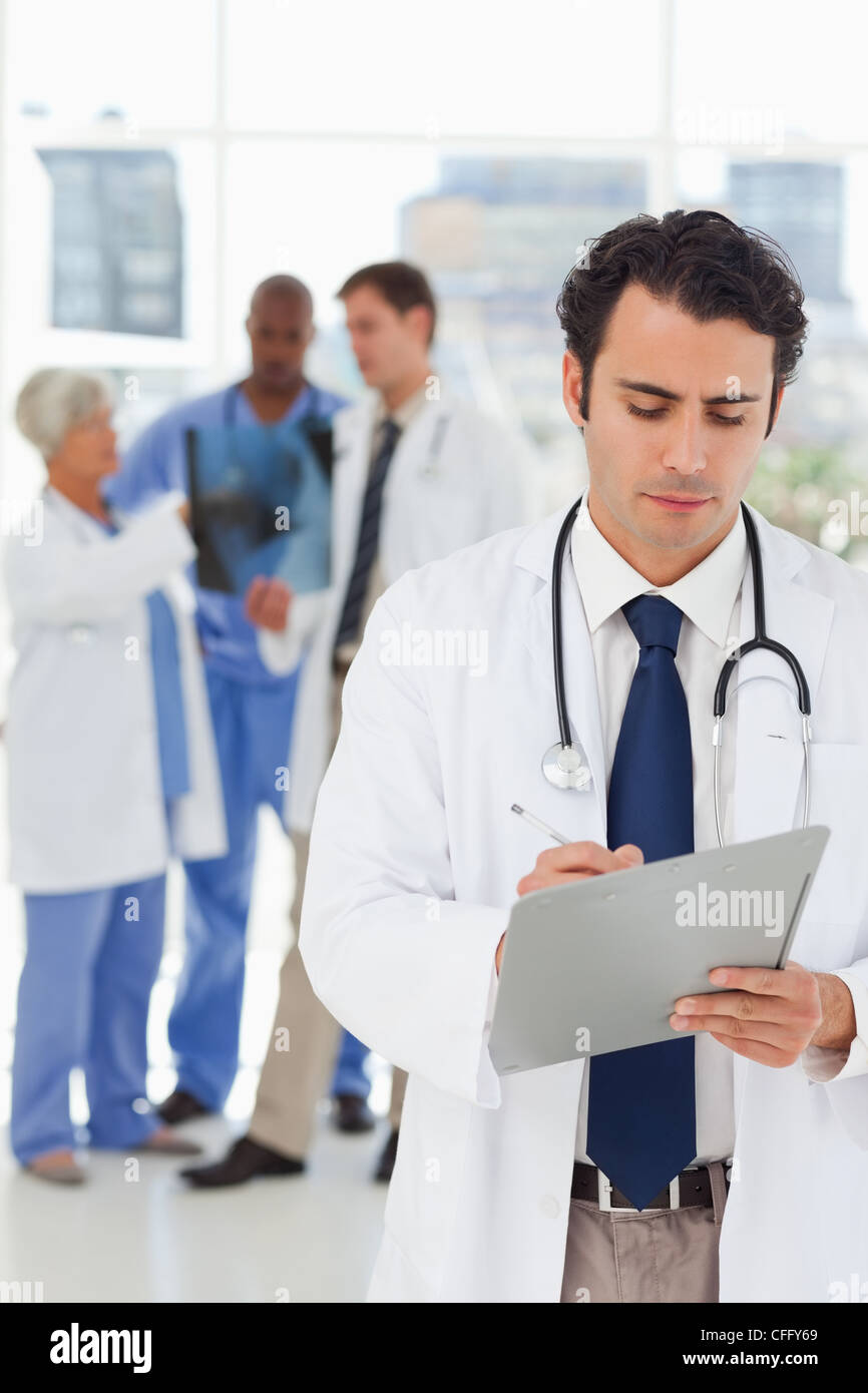 Young doctor taking notes hi-res stock photography and images - Alamy