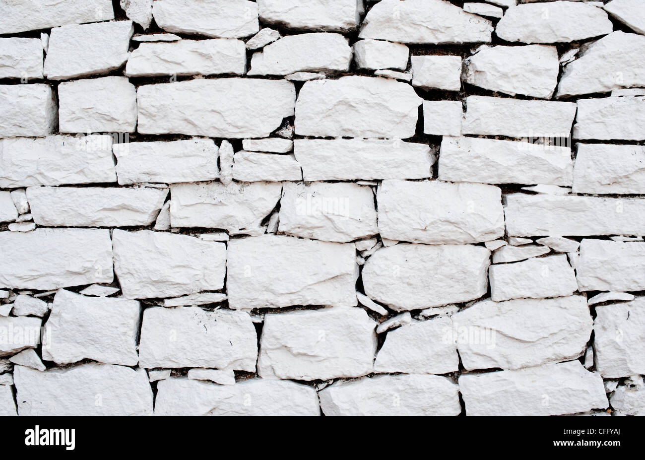 White painted dry stone wall Stock Photo