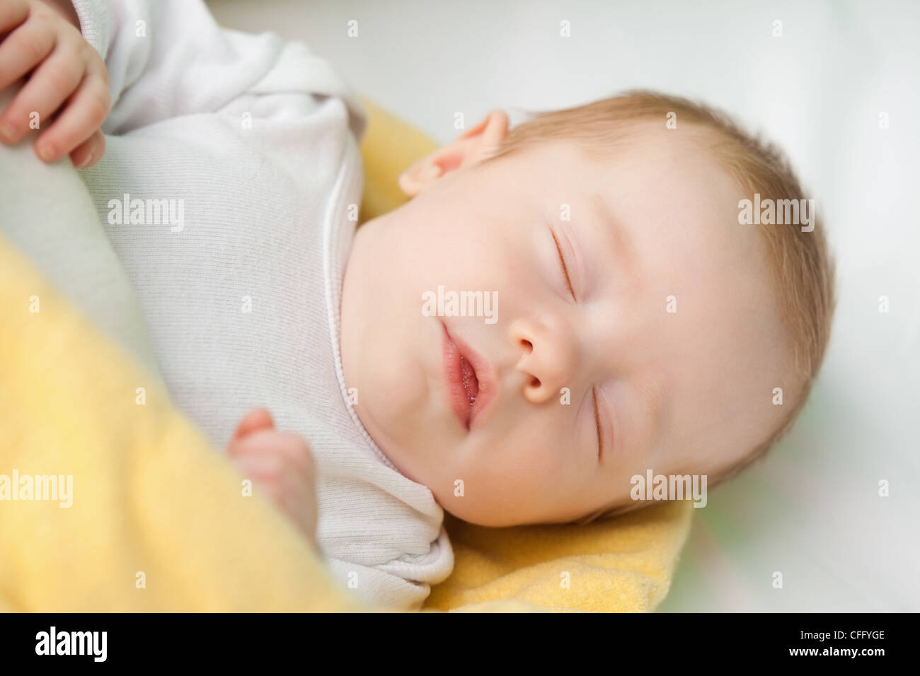 Cute baby taking a nap Stock Photo