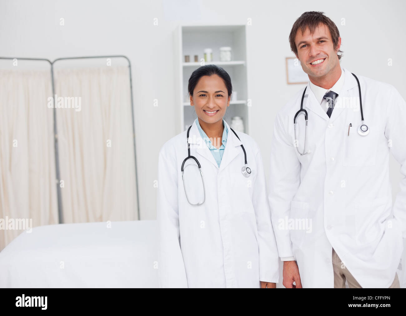 Young smiling doctors standing up side by side Stock Photo