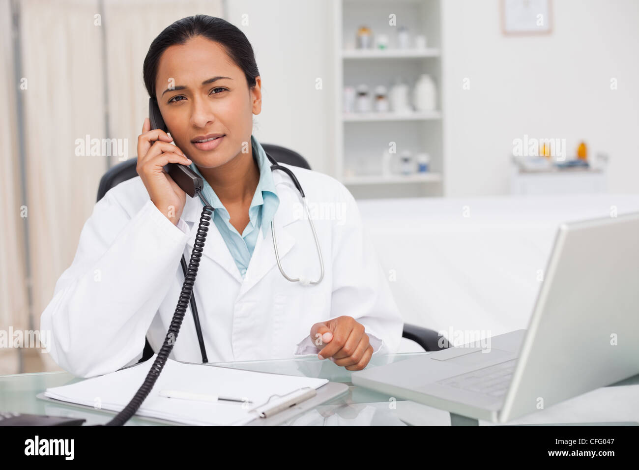 Black doctor talking camera sitting hi-res stock photography and images ...