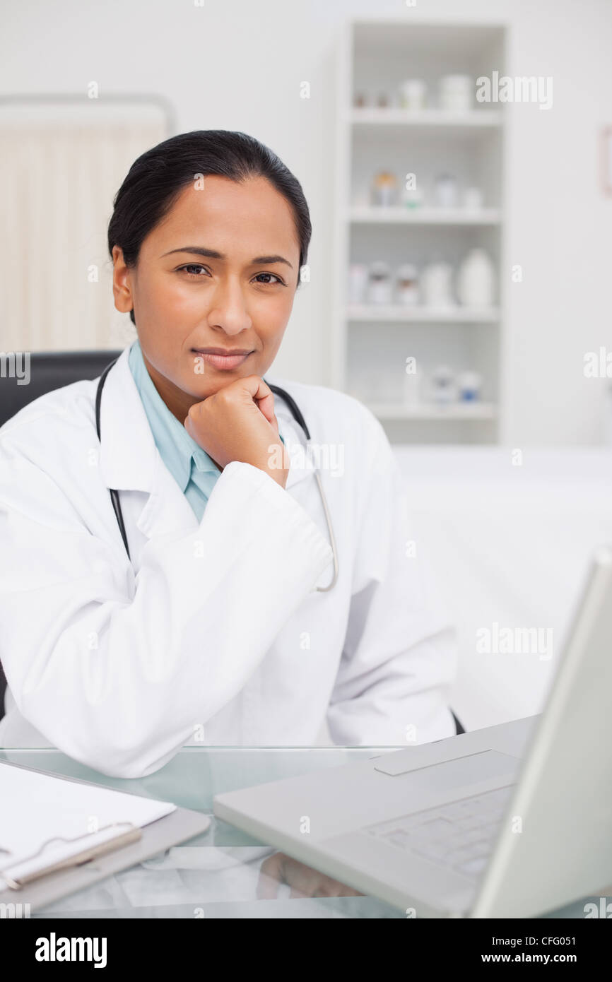 Doctor looking at camera desk hi-res stock photography and images - Alamy