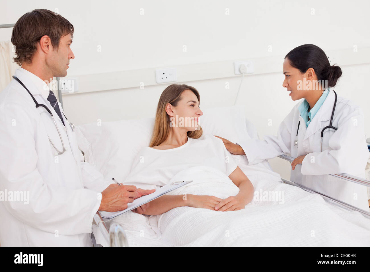Placing female nurse holding hi-res stock photography and images - Alamy