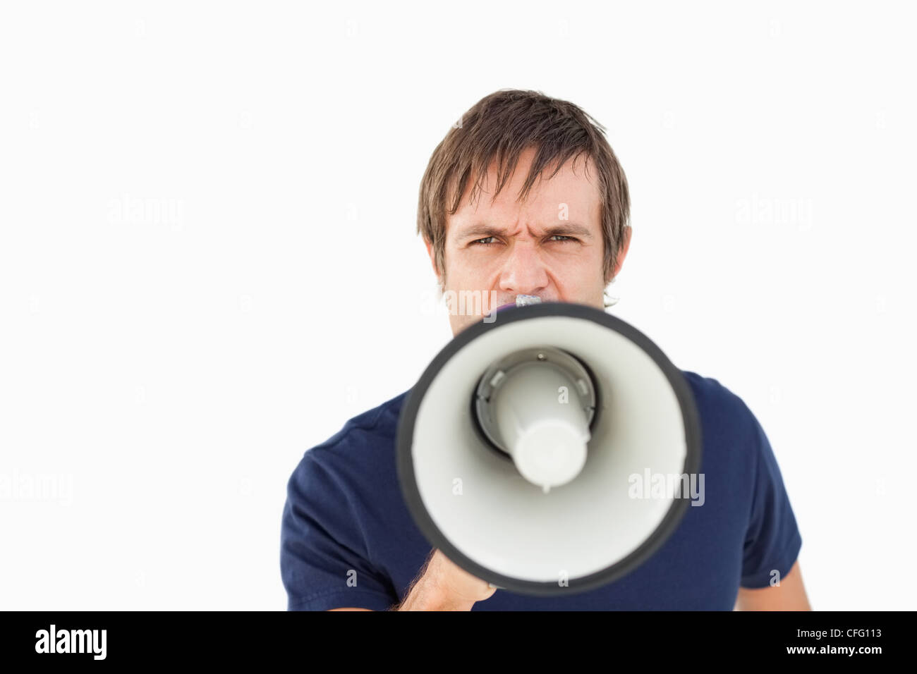 Furious man using a megaphone to talk Stock Photo