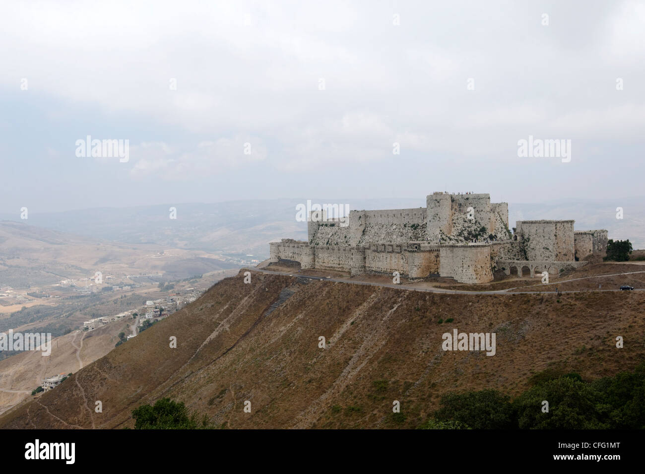 Panoramic view of the south-west side of Krac des Chevalies, one of the greatest crusader castles. Syria. Stock Photo