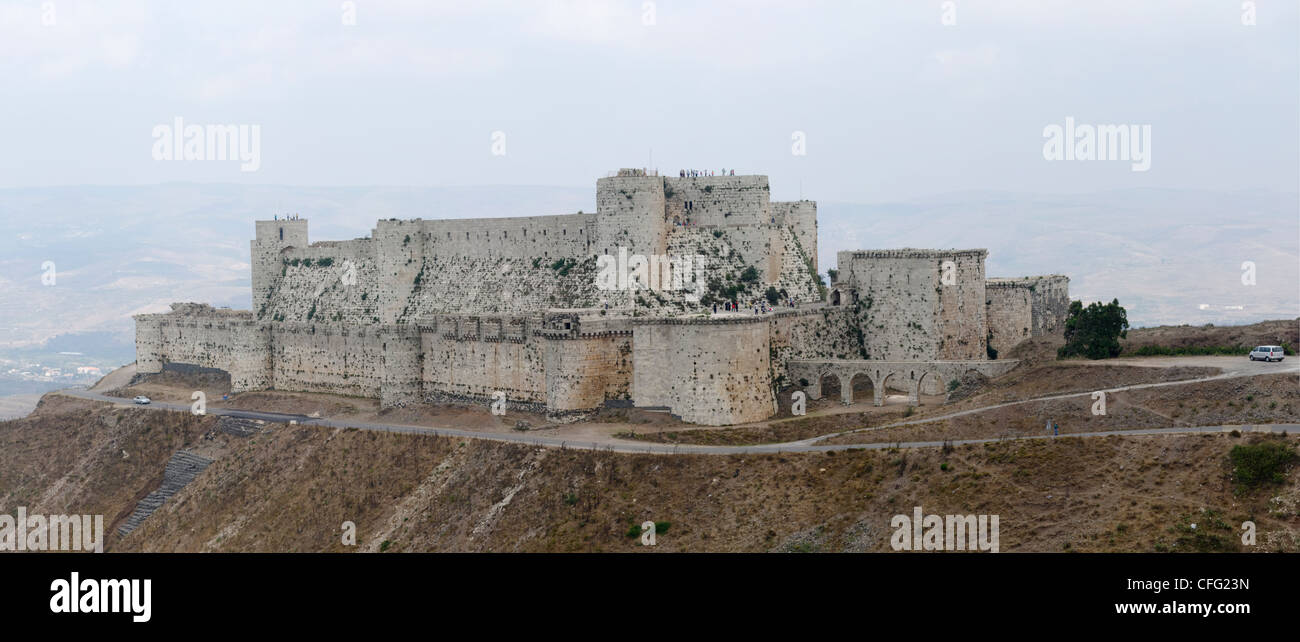 Panoramic view of the south-west side of Krac des Chevalies, one of the greatest crusader castles. Syria. Stock Photo