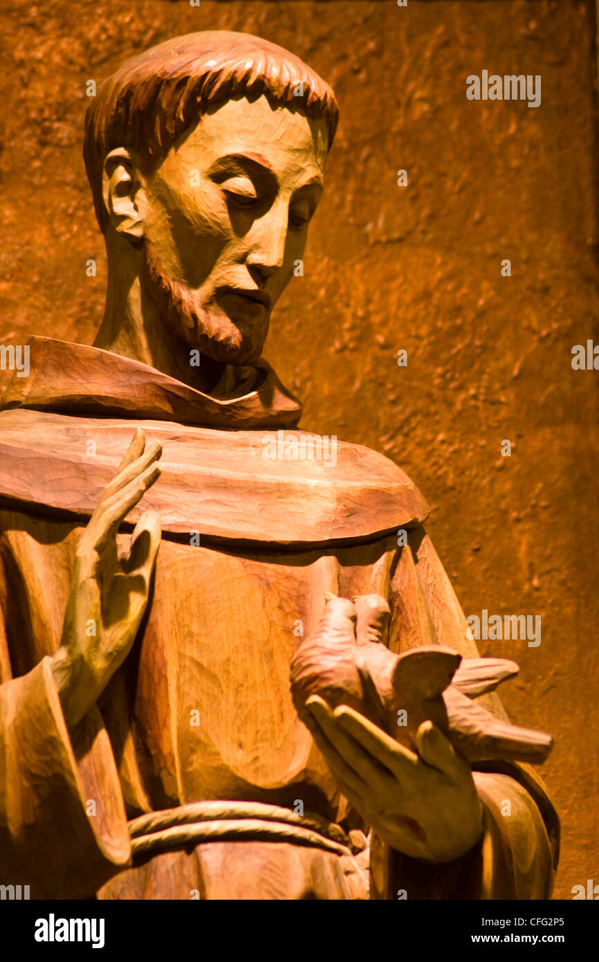 A Franciscan monk bas relief blessing a pair of doves at the Franciscan Monastery of the Holy Land in America Washington DC Stock Photo