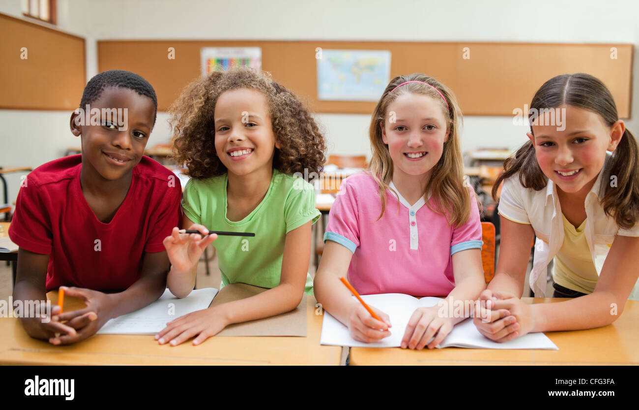Smiling students working together Stock Photo