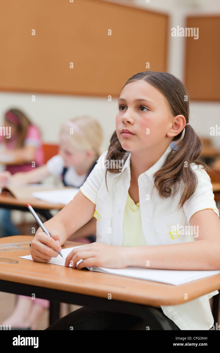 Primary school student at her desk Stock Photo