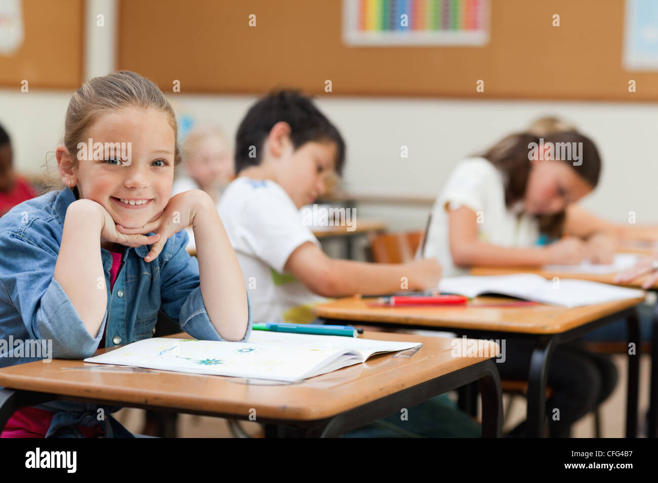 Side view of happy schoolgirl during class Stock Photo - Alamy