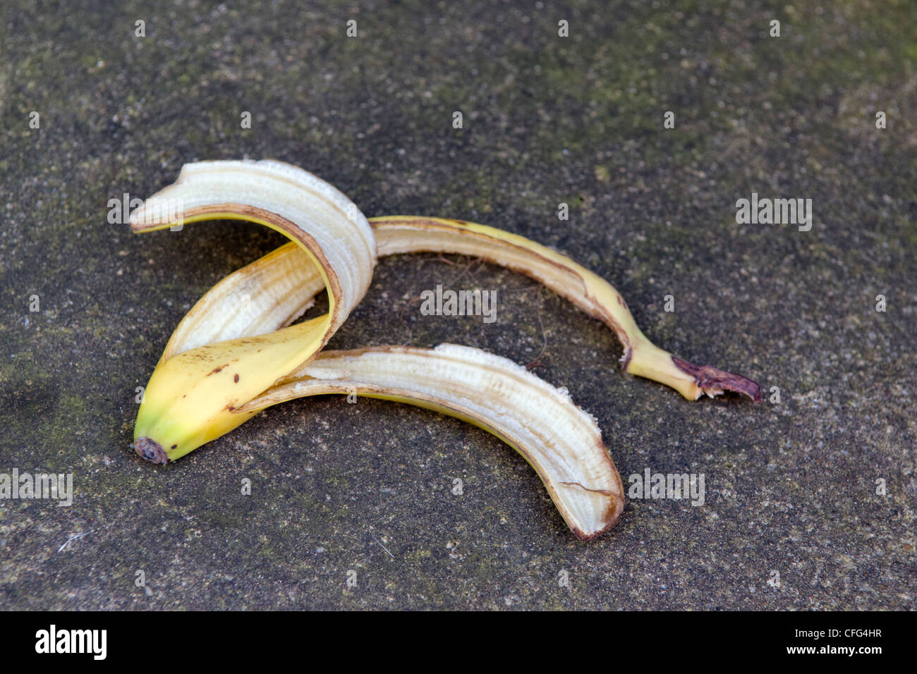 Discarded banana skin left on path taken in Bristol, United Kingdom Stock Photo