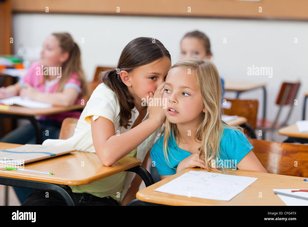 Girls talking in class Stock Photo - Alamy