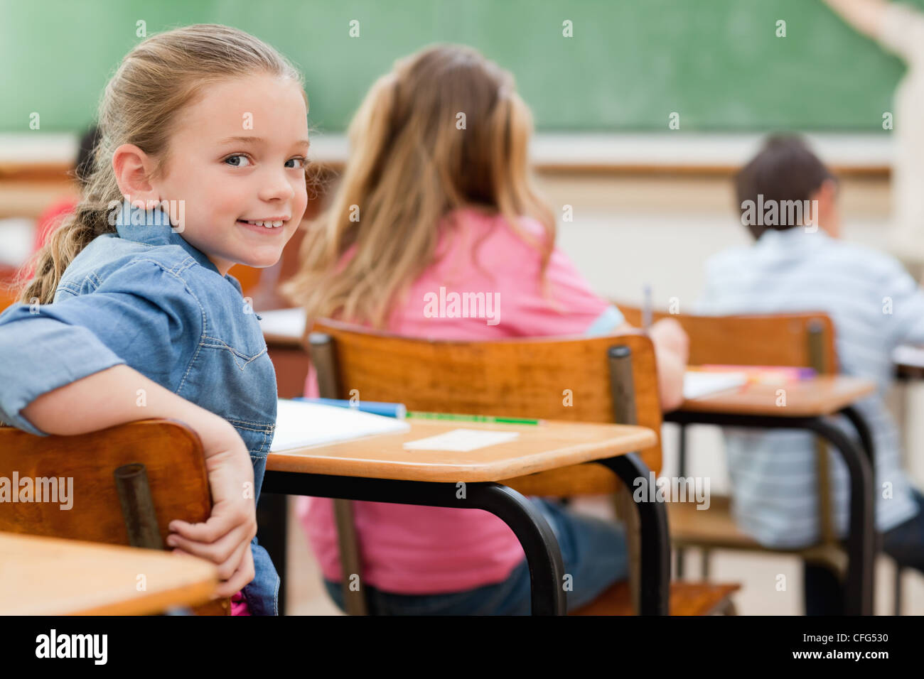 Primary student turned around during class Stock Photo