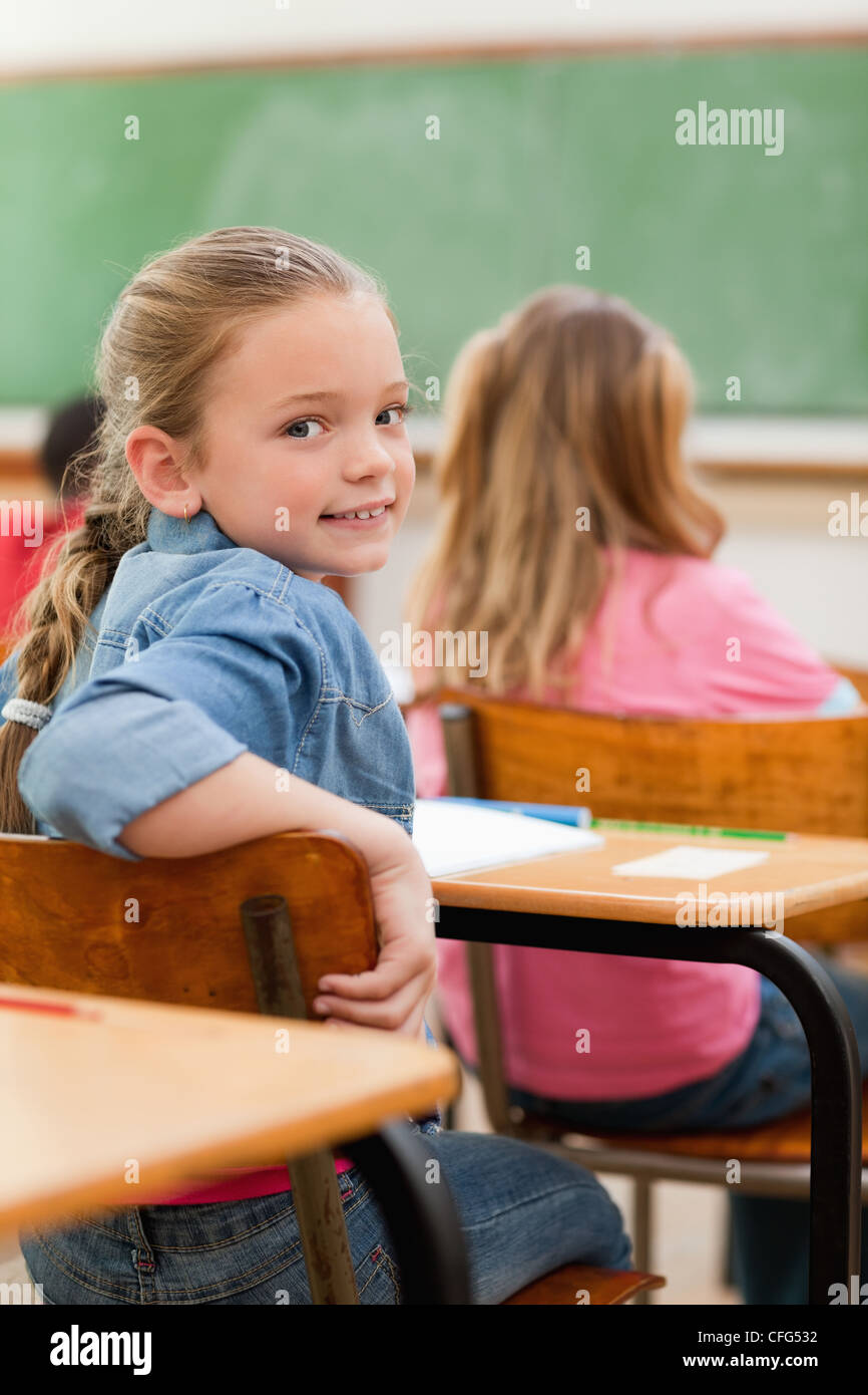 Elementary student turning around in class Stock Photo