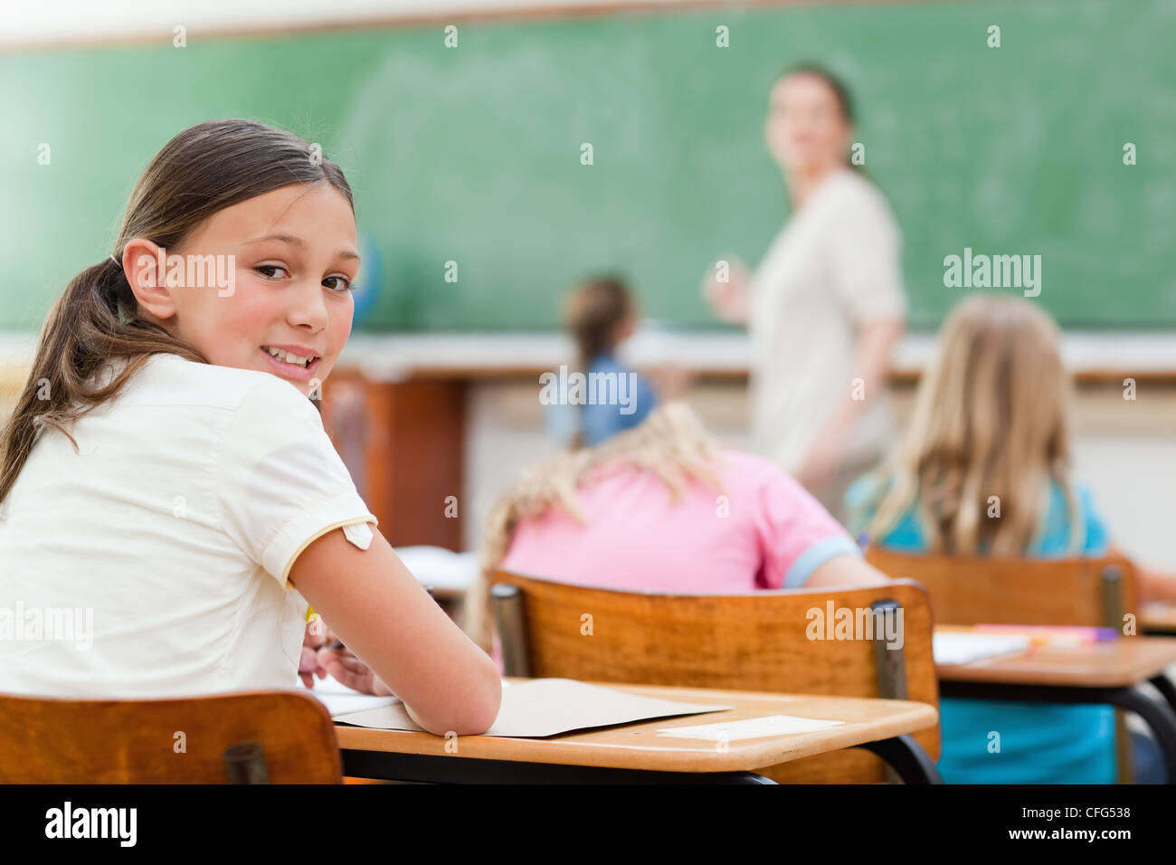 Student turned around in class Stock Photo