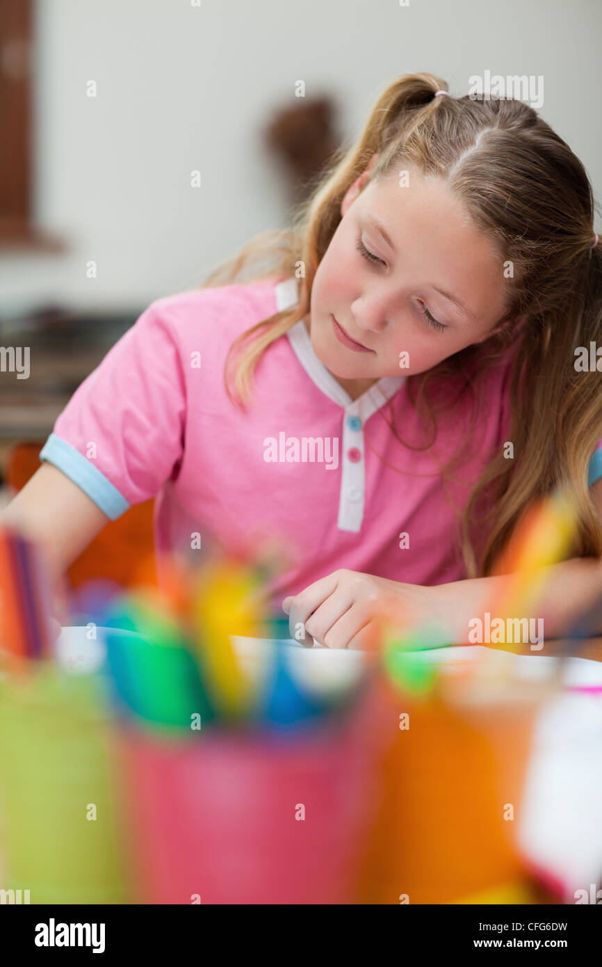 Student focused on her exercise book Stock Photo