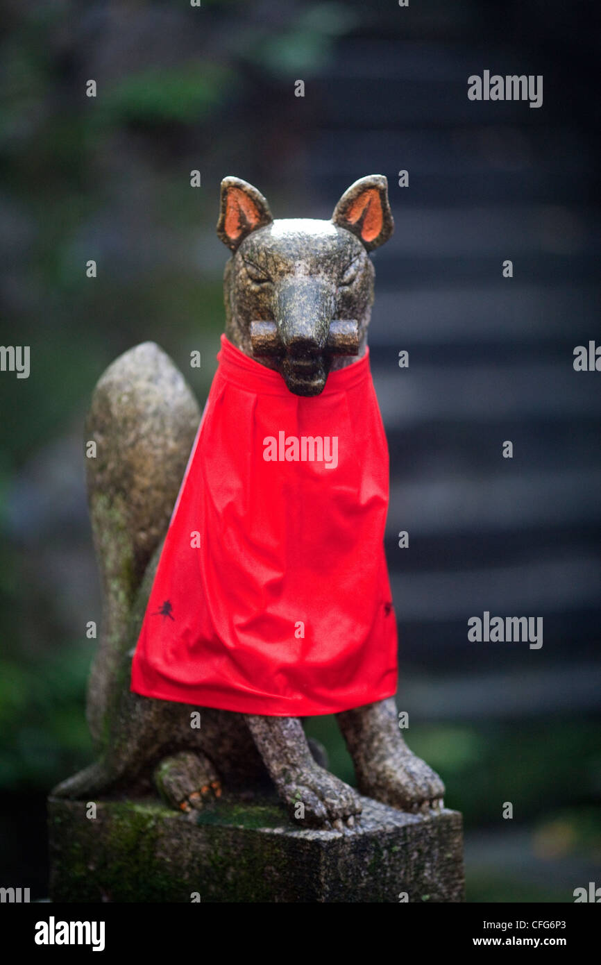 Guarding dog statue at FushimiInari Taisha shrine in Kyoto, Japan