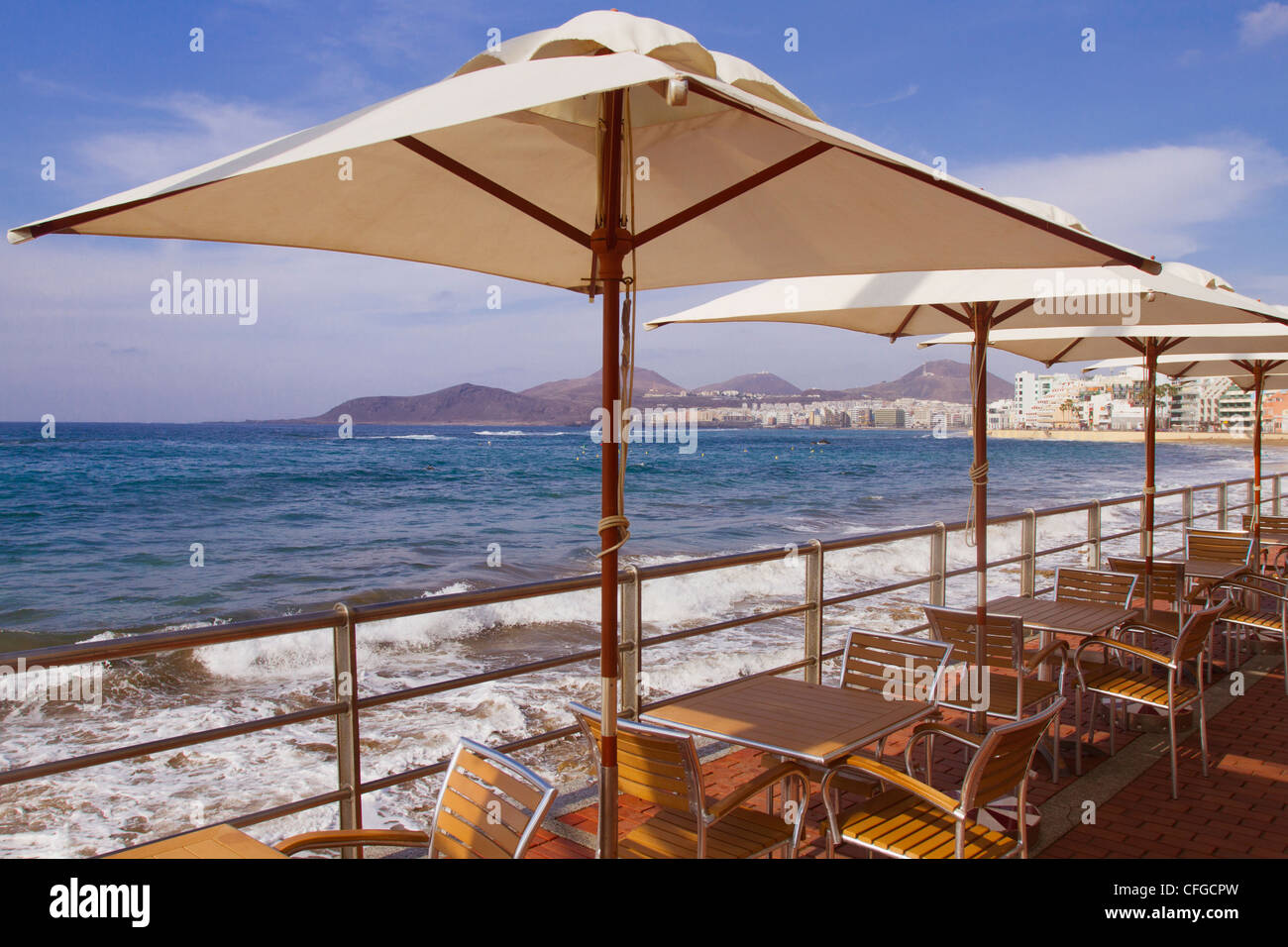 Tables and parasols on Canteras Beach promenade in Gran Canaria Stock Photo