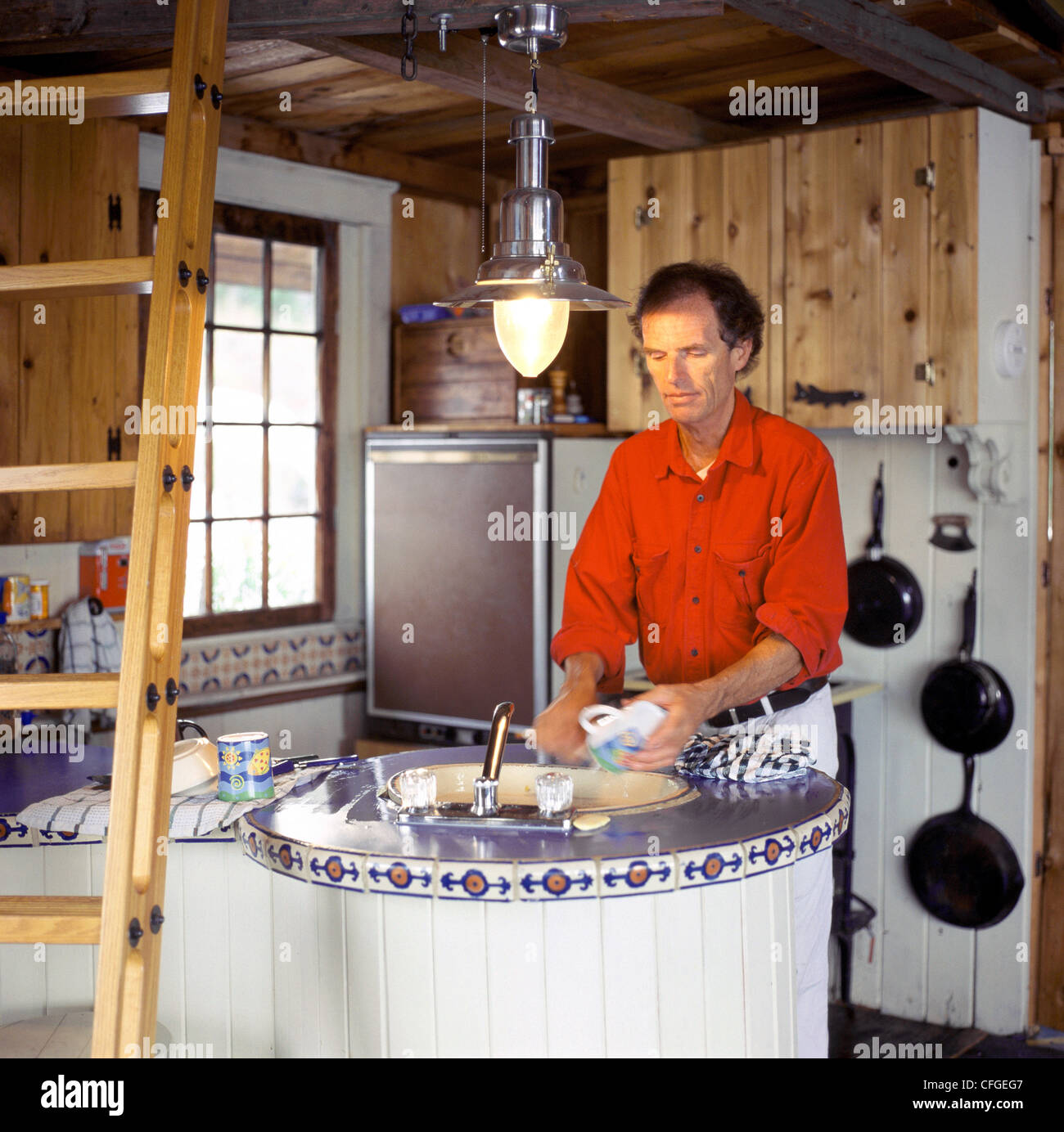 Man in Cottage Kitchen, Gunn Lake, Minaki, Ontario Stock Photo Alamy
