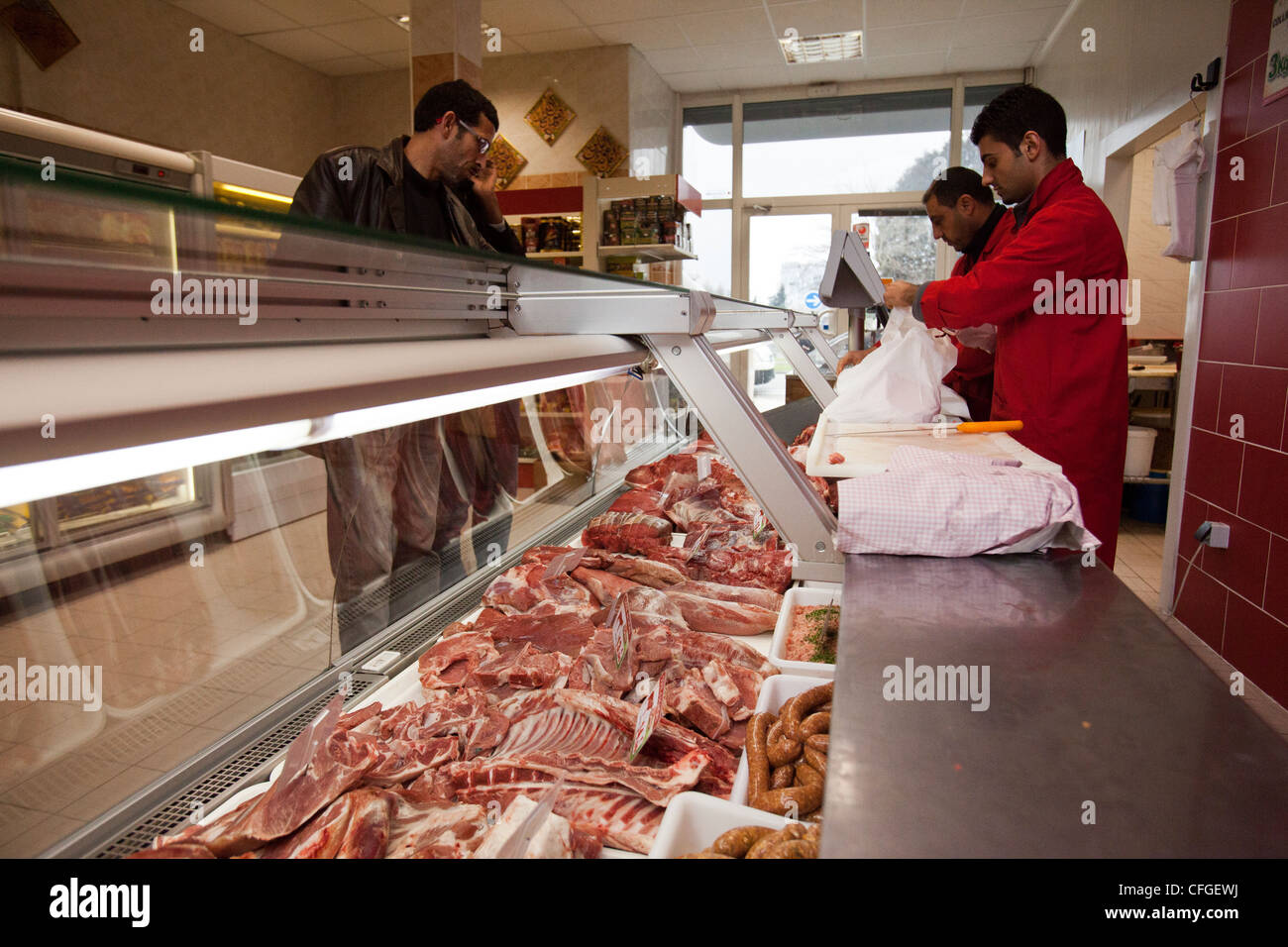 A butcher serves a customer Halal meat at a Halal supermarket in Nantes, France Stock Photo Alamy