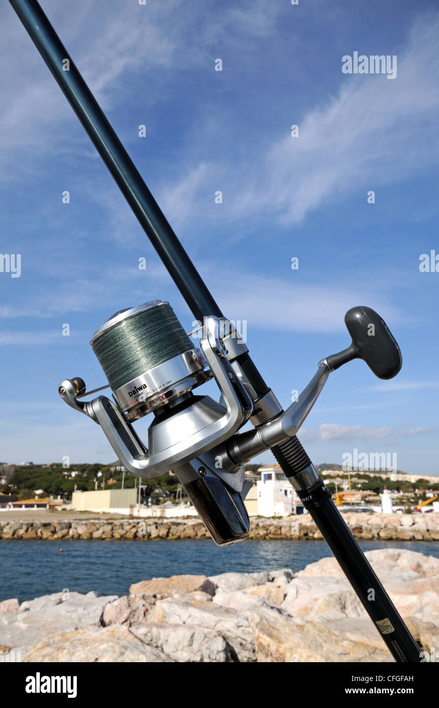 https://c8.alamy.com/comp/CFGFAH/modern-daiwa-fishing-reel-and-rod-puerto-cabopino-costa-del-sol-malaga-CFGFAH.jpg